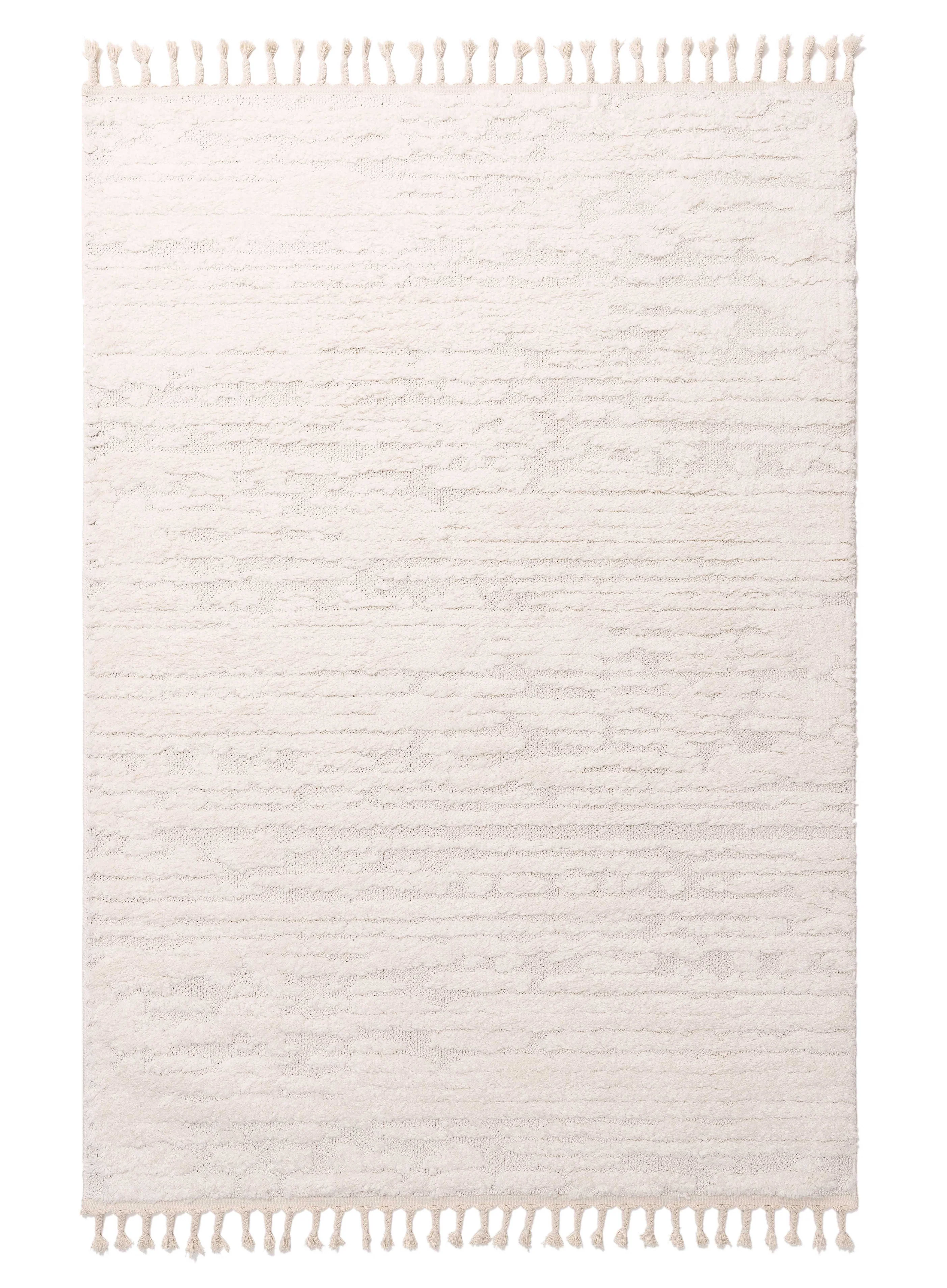 Serena Ivory Cream Textured Tassel Rug
